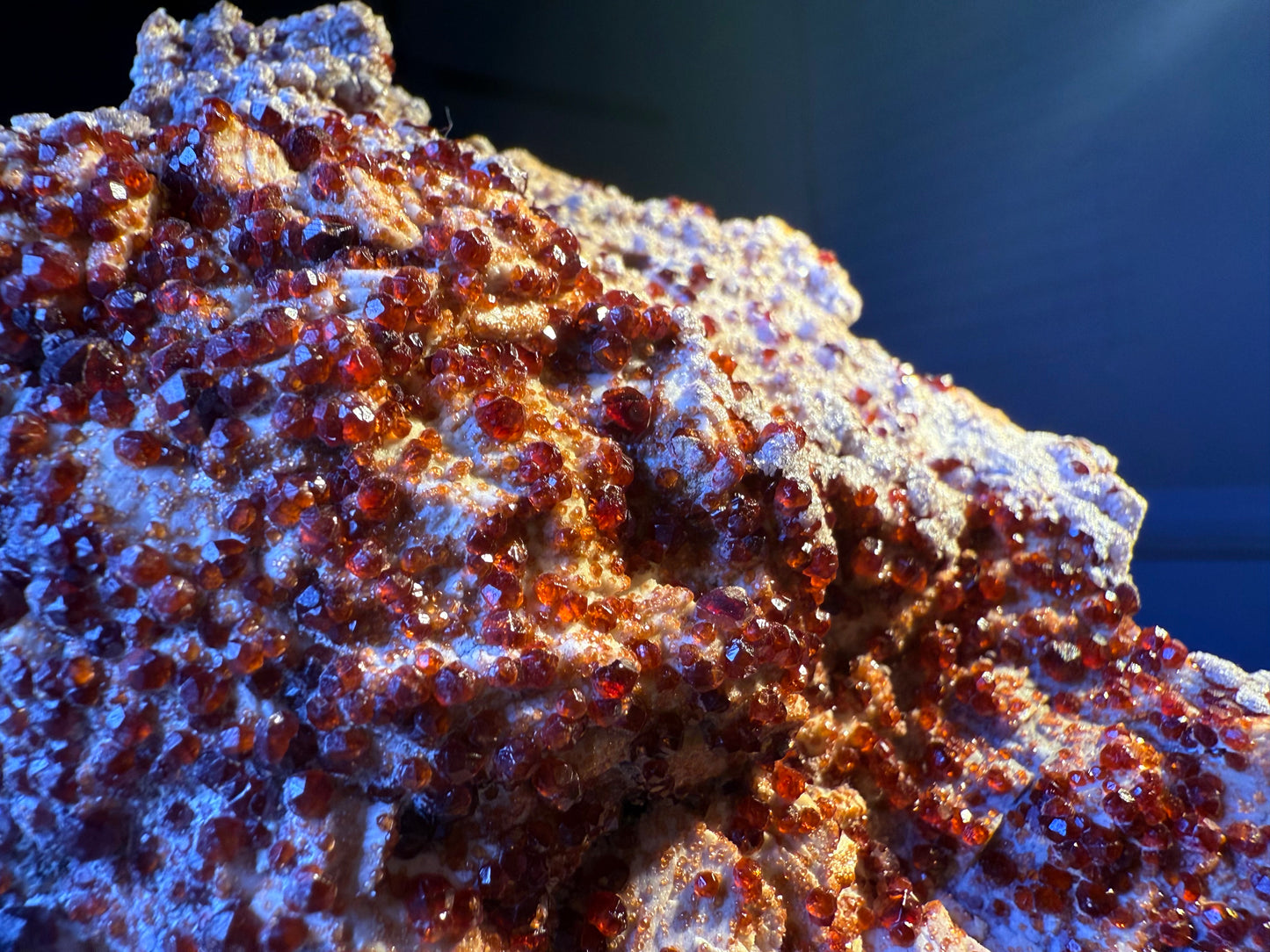 garnet specimen with sparkling reddish-orange crystals on matrix, Fujian, China.
