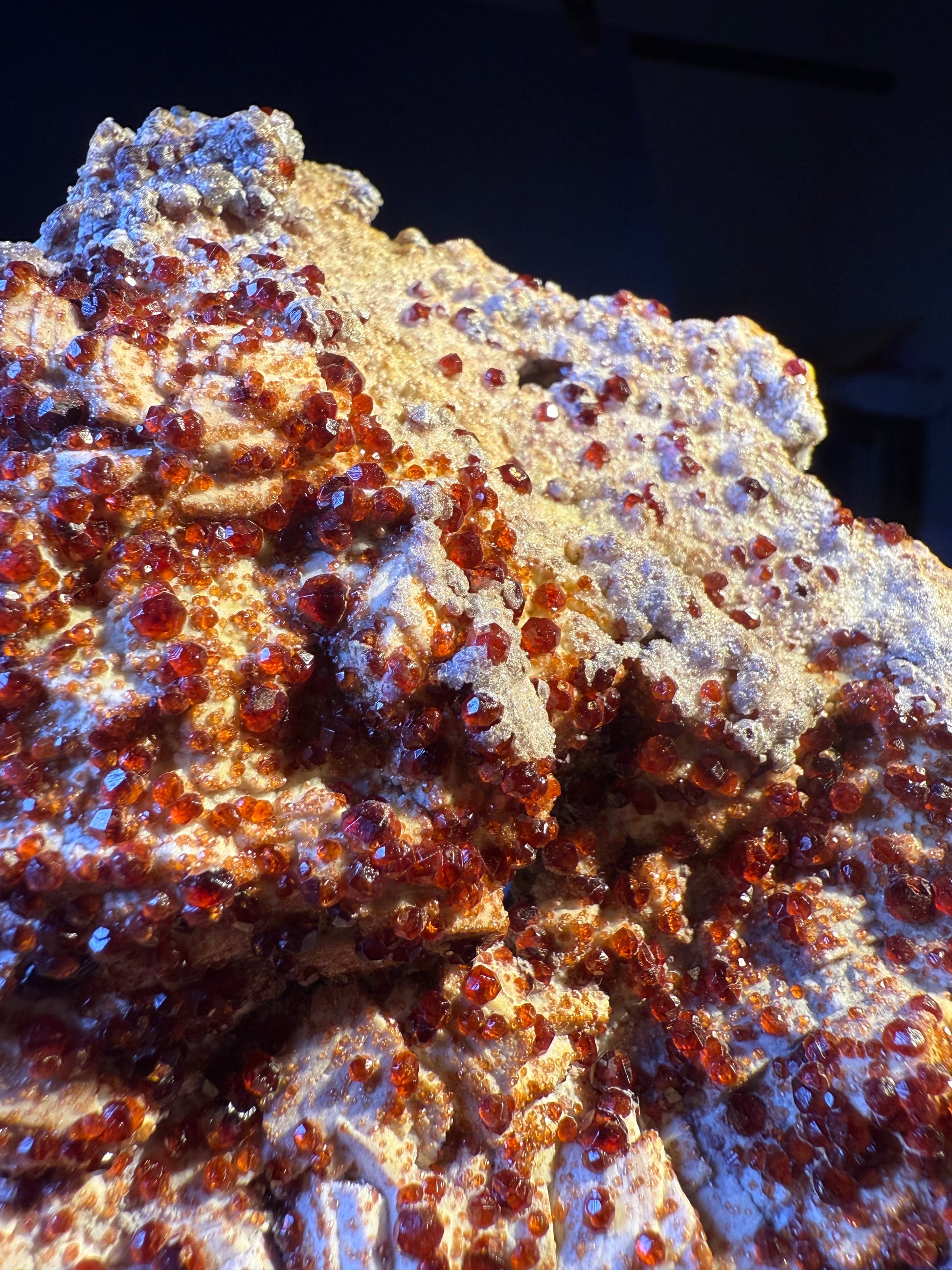 garnet specimen with sparkling reddish-orange crystals on matrix, Fujian, China.
