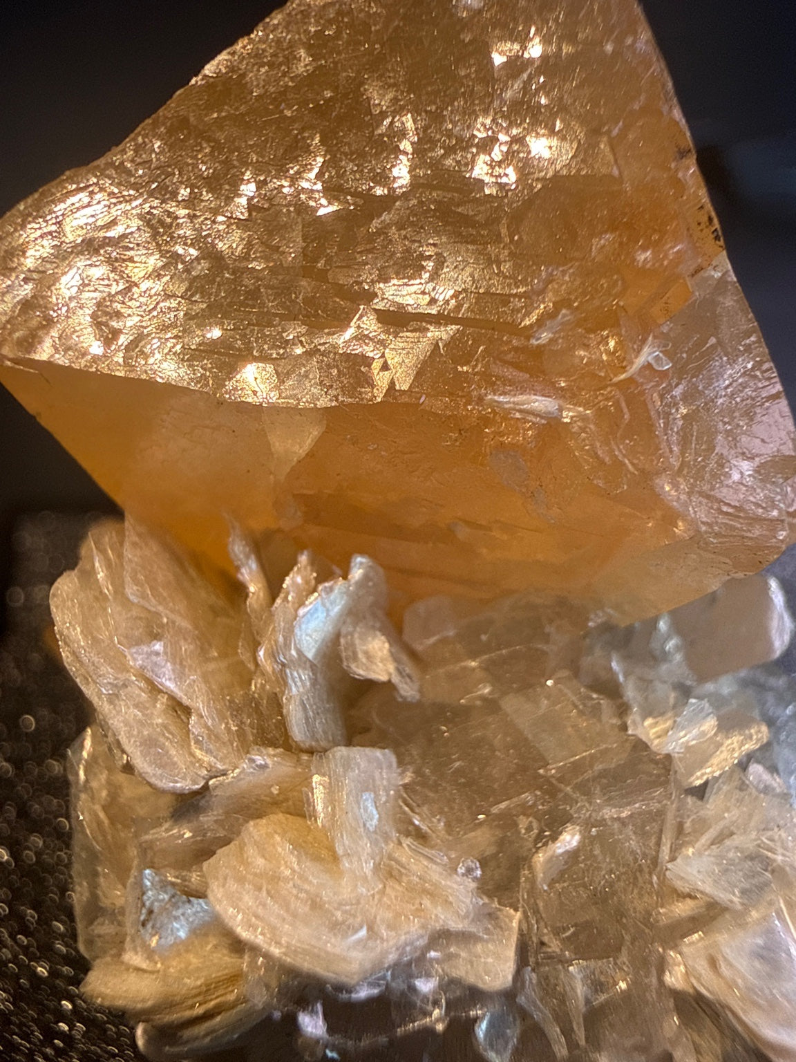 Scheelite with Muscovite specimen from Xuebaoding, Sichuan — fiery orange scheelite on silvery muscovite, vitreous to resinous (scheelite), pearly (muscovite) luster, translucent to transparent (scheelite), transparent on edges (muscovite) (4×4×5 cm), additional angle view — SCH-0042
