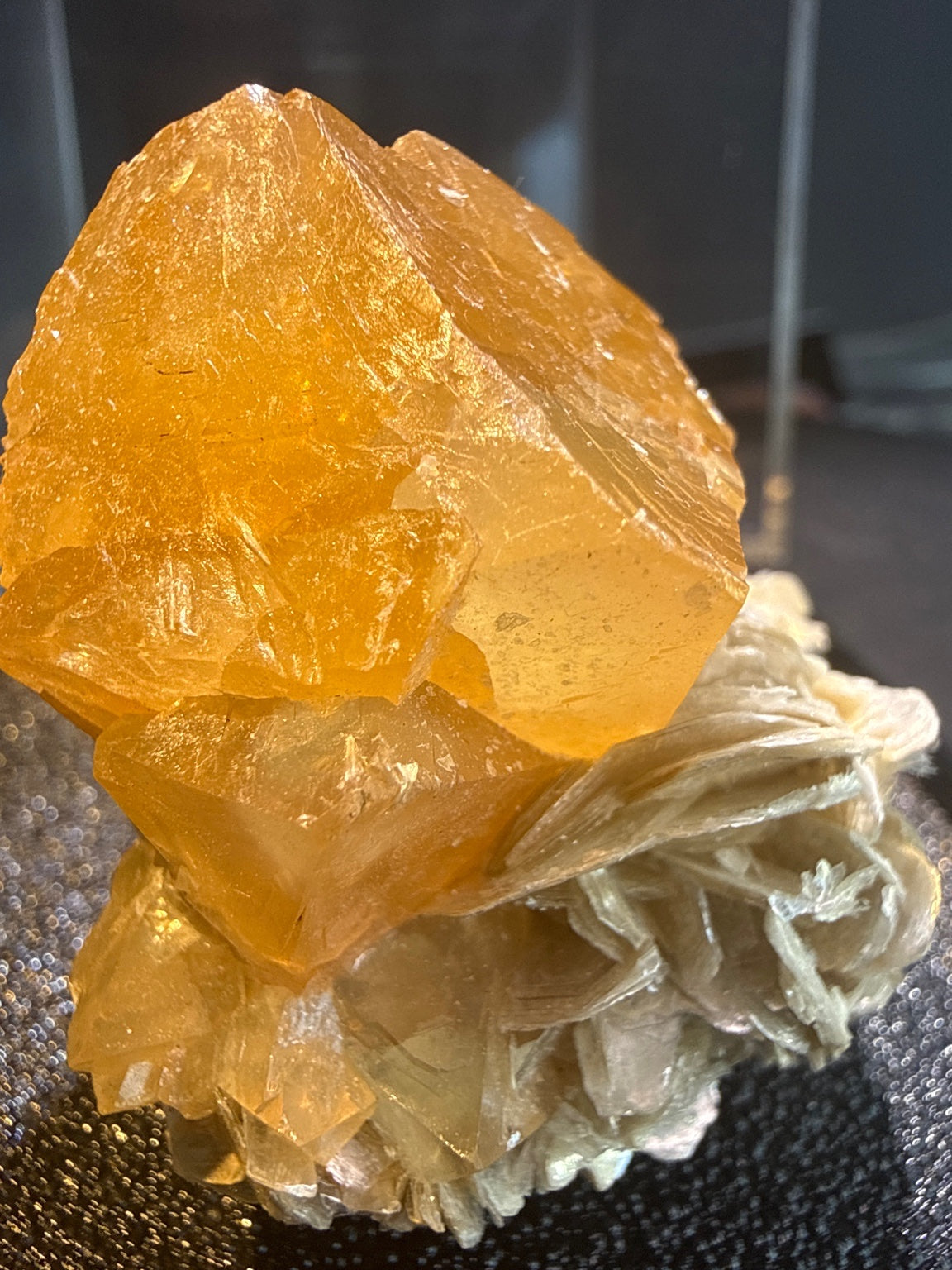 Scheelite with Muscovite specimen from Xuebaoding, Sichuan — fiery orange scheelite on silvery muscovite, vitreous to resinous (scheelite), pearly (muscovite) luster, translucent to transparent (scheelite), transparent on edges (muscovite) (4×4×5 cm), close-up detail of crystal structure — SCH-0042