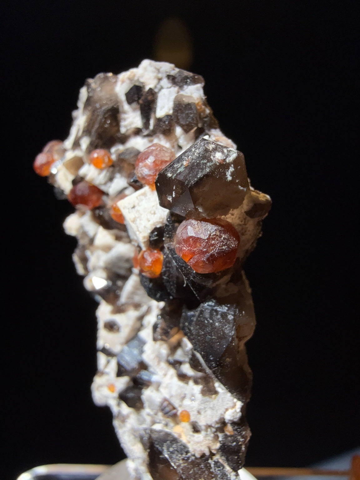 Spessartine Garnet with Smoky Quartz on Muscovite mica-schist matrix specimen from Putian , Fujian — vivid orange-red spessartine garnets on smoky quartz and silvery muscovite, vitreous to subadamantine (garnet), vitreous (quartz), pearly (muscovite) luster, transparent to translucent (garnet and quartz), opaque (matrix) (3×2×6.5 cm), additional angle view — SPE-0017