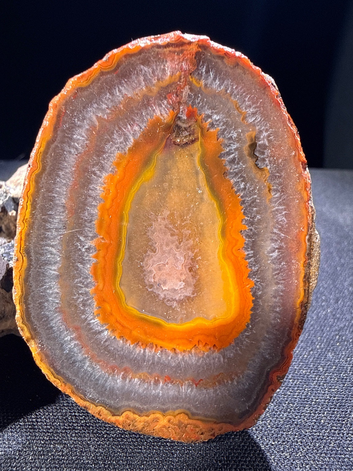 Zhanguo Agate specimen from Xuanhua, Zhangjiakou — deep orange, yellow, and gray banded zhanguo agate, vitreous luster, translucent (5.5×4.1×1.8 cm), additional angle view — ZHA-0033