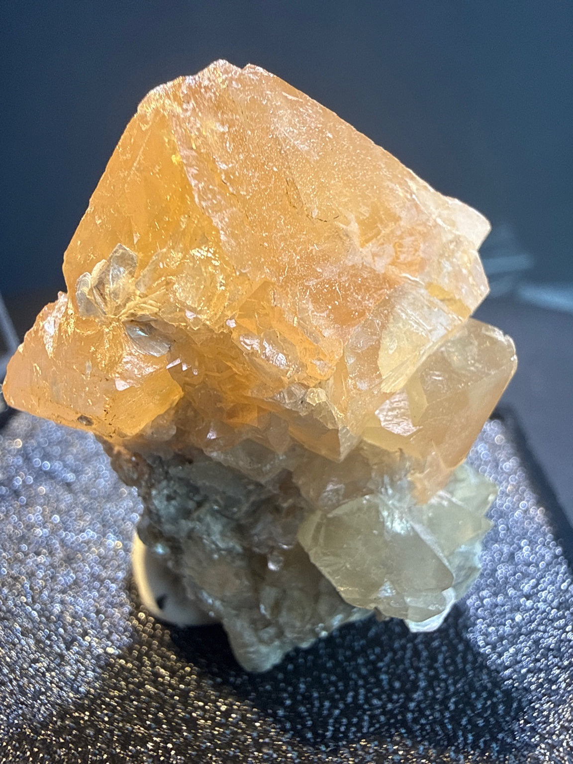 Scheelite with Muscovite specimen from Xuebaoding, Sichuan — fiery orange scheelite on silvery muscovite, vitreous to resinous (scheelite), pearly (muscovite) luster, translucent to transparent (scheelite), transparent on edges (muscovite) (4×4×5 cm), additional angle view — SCH-0042